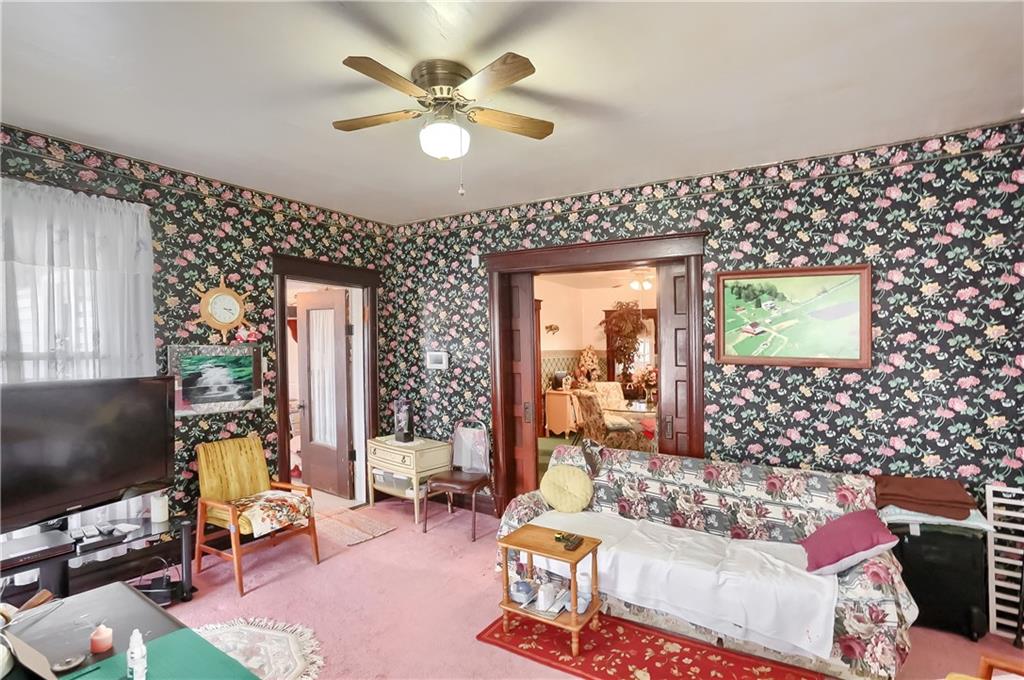 191 Pyle Road Jefferson, PA 15344 - Photo 16 of 24 a living room with furniture a flat screen tv and a fireplace