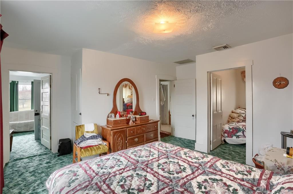 191 Pyle Road Jefferson, PA 15344 - Photo 18 of 24 a bedroom with a bed and a dresser