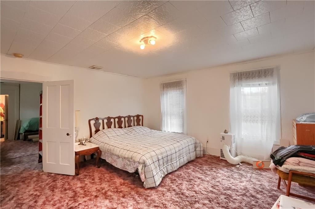 191 Pyle Road Jefferson, PA 15344 - Photo 21 of 24 a bedroom with a bed and a cabinets