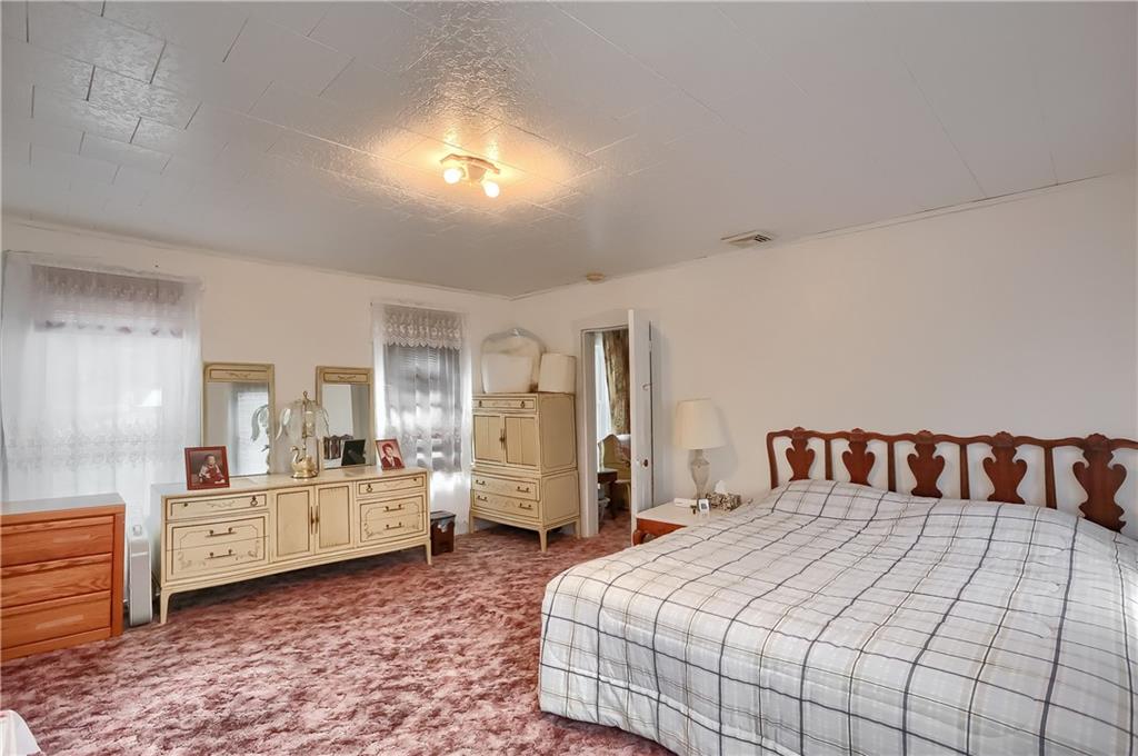 191 Pyle Road Jefferson, PA 15344 - Photo 22 of 24 a bedroom with a bed and window