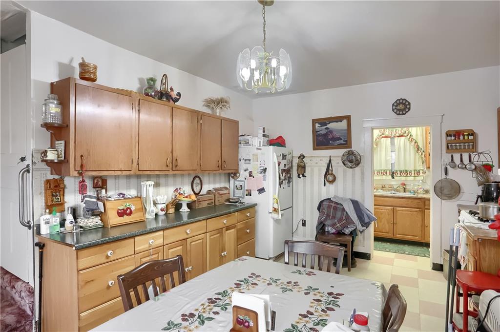 191 Pyle Road Jefferson, PA 15344 - Photo 4 of 24 a kitchen with cabinets a sink stove and refrigerator