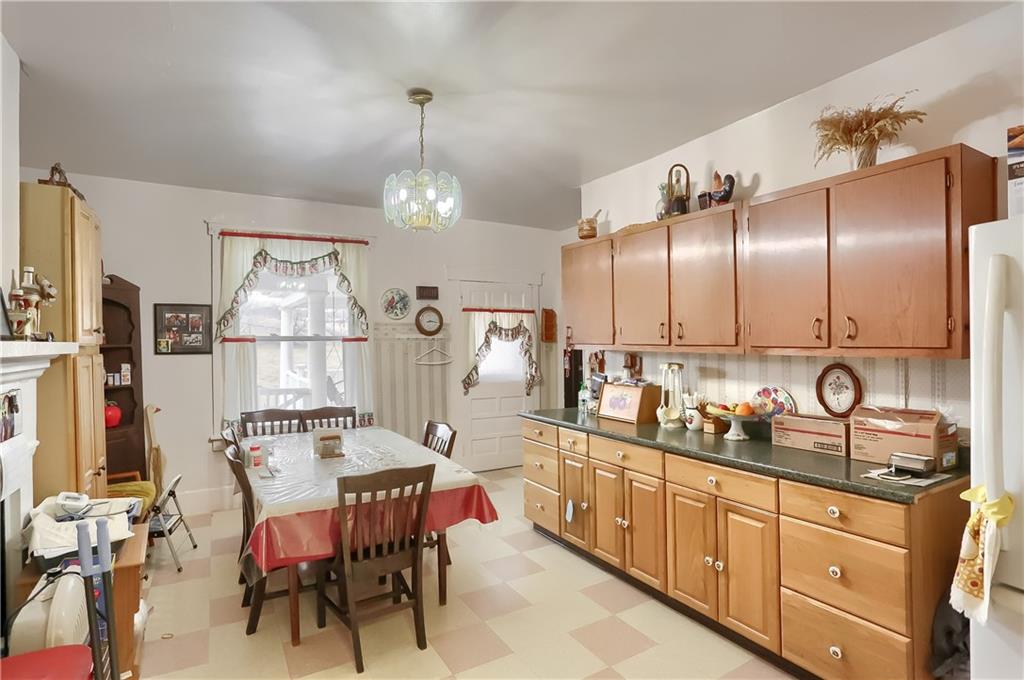 191 Pyle Road Jefferson, PA 15344 - Photo 6 of 24 a kitchen with stainless steel appliances kitchen island granite countertop a sink cabinets and wooden floor