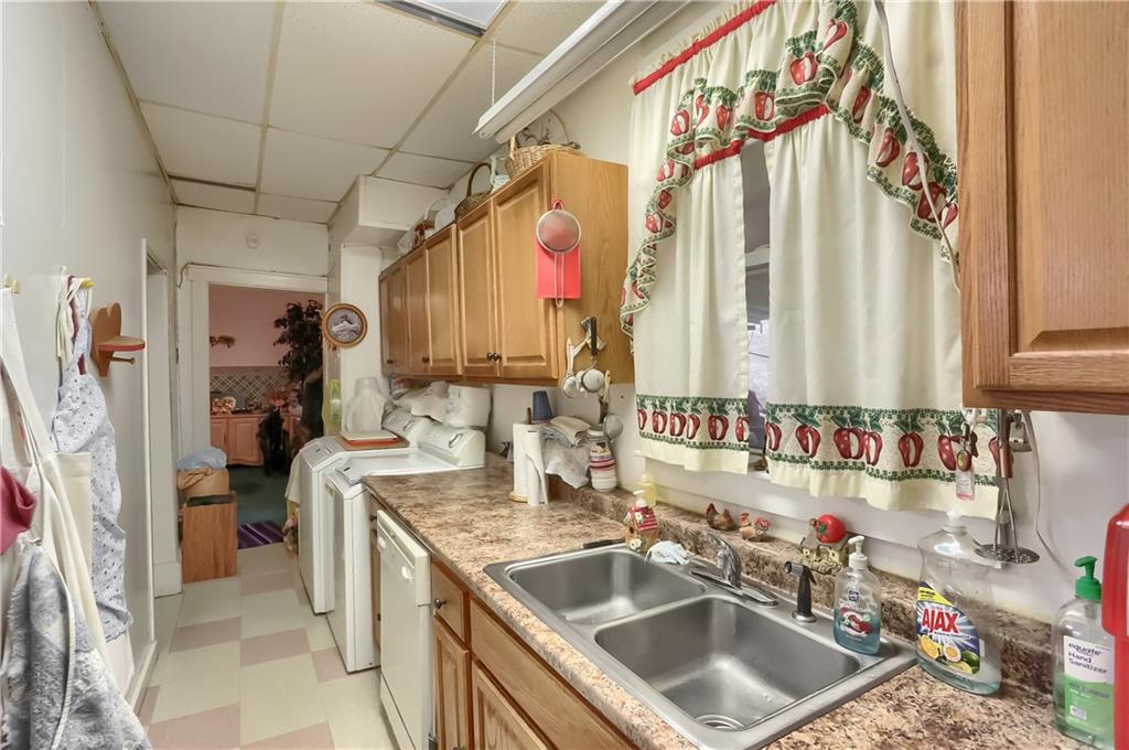 191 Pyle Road Jefferson, PA 15344 - Photo 7 of 24 a kitchen with a sink and a refrigerator