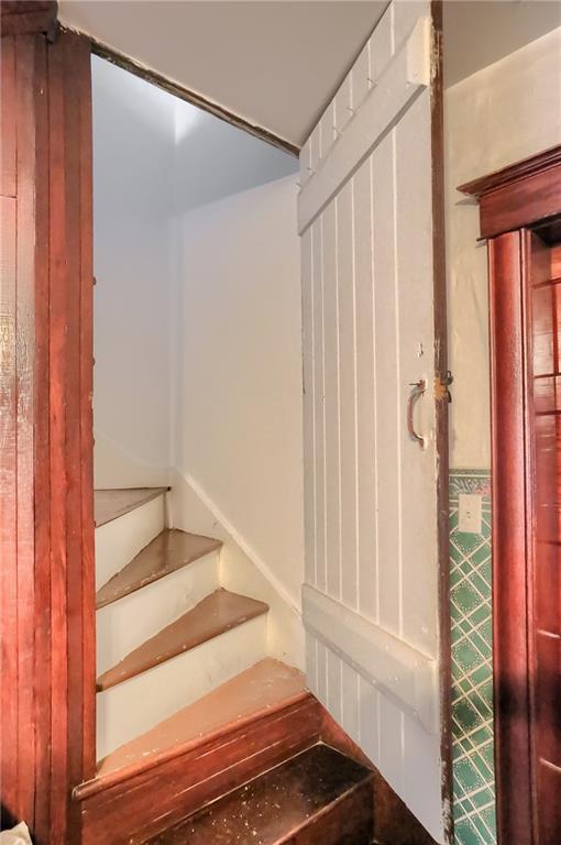 191 Pyle Road Jefferson, PA 15344 - Photo 9 of 24 a view of staircase with white walls and a window