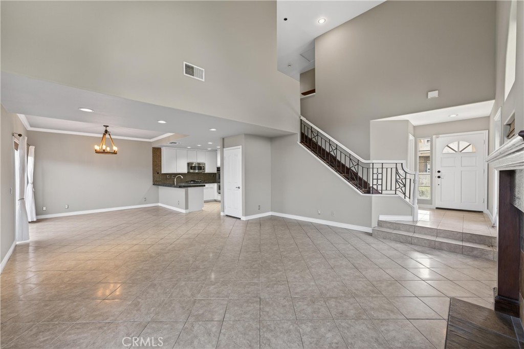152 Terraza Court Costa Mesa, CA 92627 - Photo 11 of 47 a view of an empty room with kitchen and a window