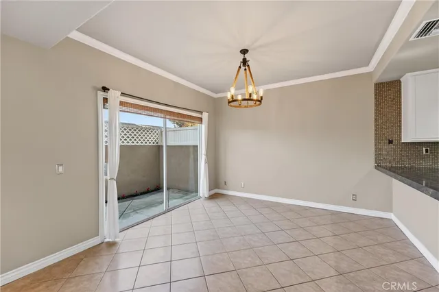 a view of a livingroom with a sink and chandelier