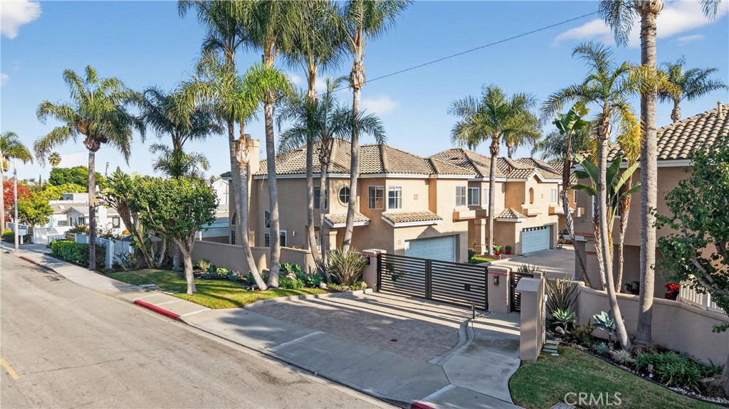 152 Terraza Court Costa Mesa, CA 92627 - Photo 2 of 47 a view of a palm trees front of house