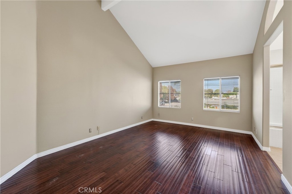 152 Terraza Court Costa Mesa, CA 92627 - Photo 26 of 47 an empty room with wooden floor and windows