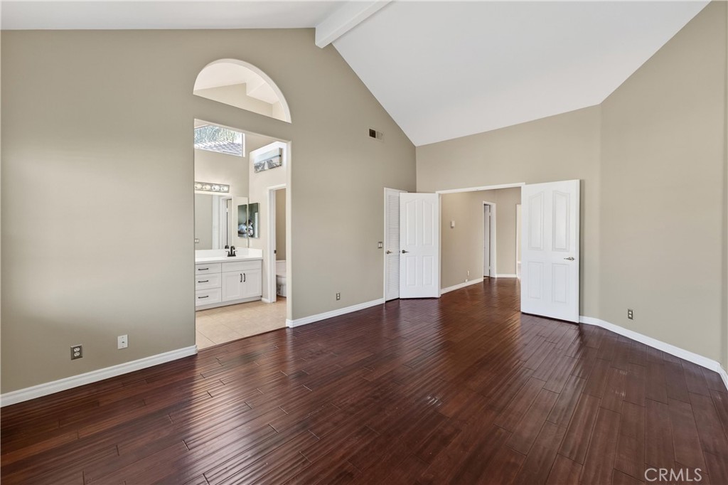152 Terraza Court Costa Mesa, CA 92627 - Photo 28 of 47 a view of an empty room with wooden floor and a window