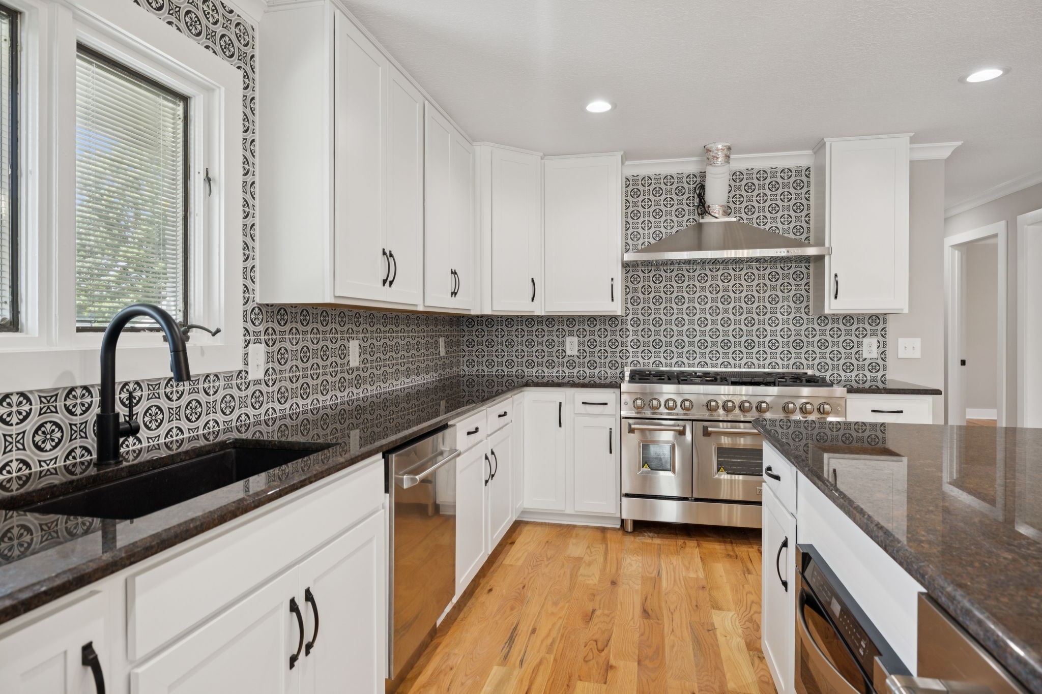 3935 Harmony Grove Road Hopkinsville, KY 42240 - Photo 11 of 64 a kitchen with a sink stove and cabinets