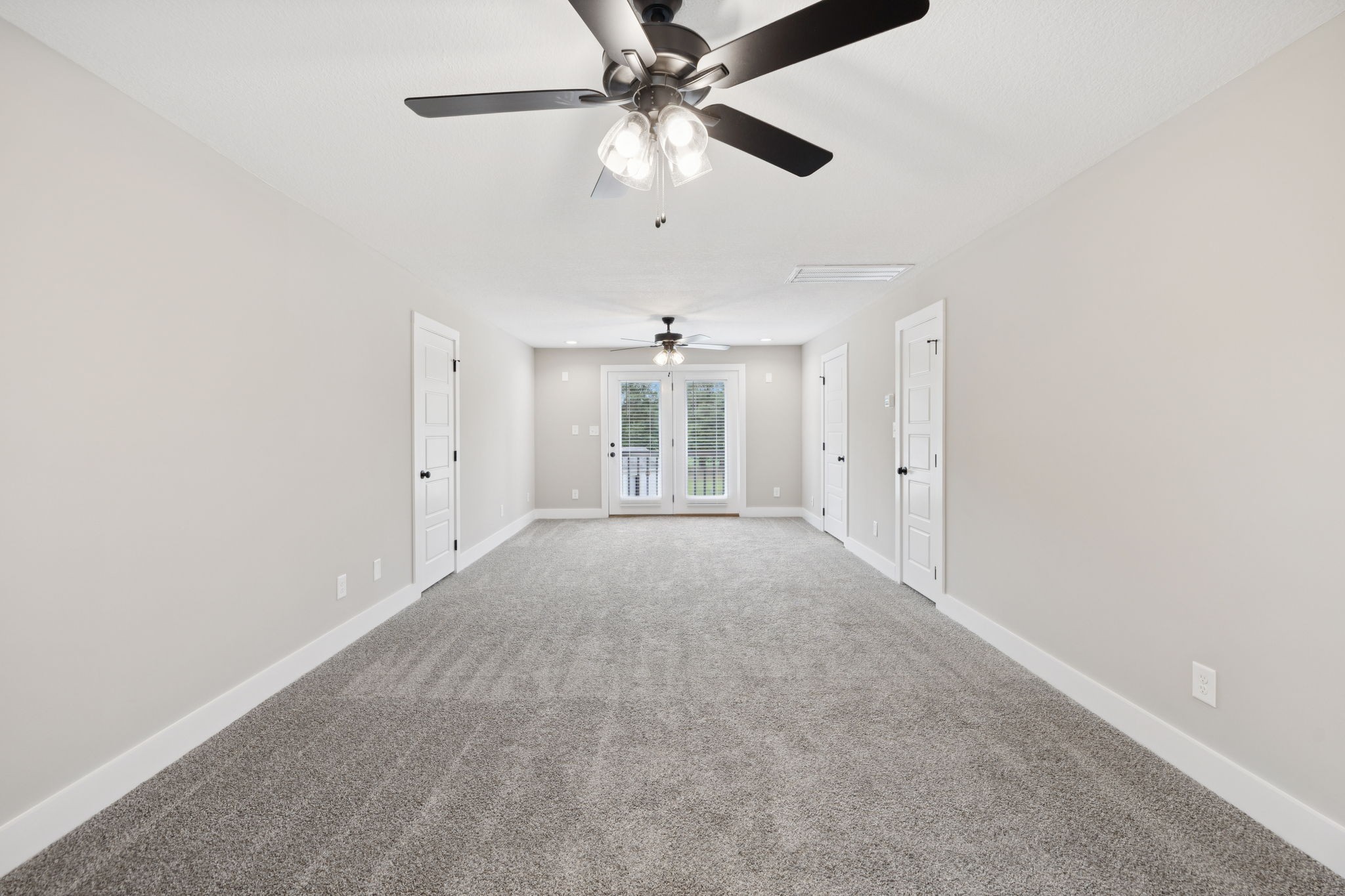 3935 Harmony Grove Road Hopkinsville, KY 42240 - Photo 23 of 64 an empty room with chandelier fan and windows