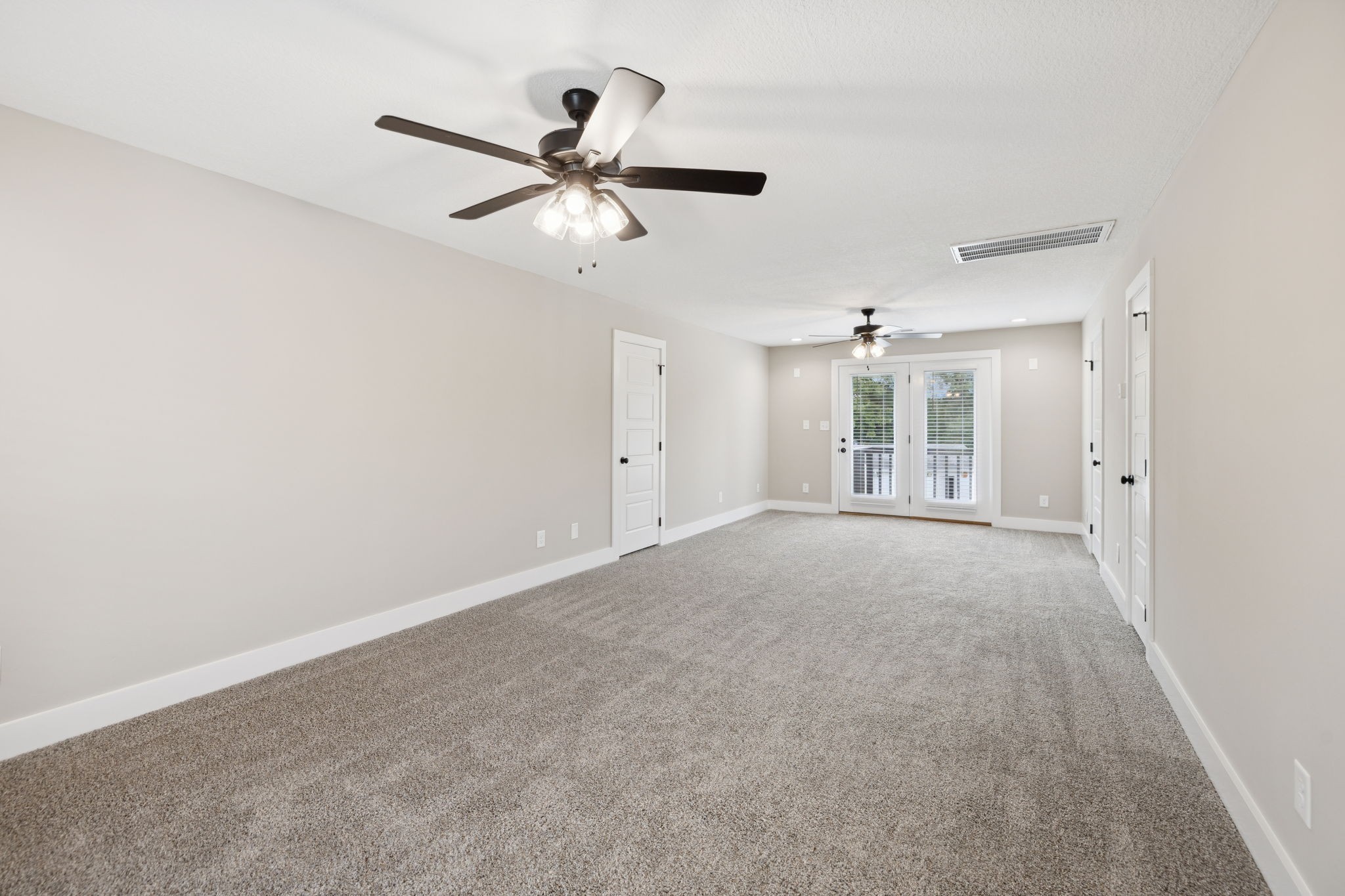 3935 Harmony Grove Road Hopkinsville, KY 42240 - Photo 25 of 64 a view of a livingroom with a ceiling fan & windows