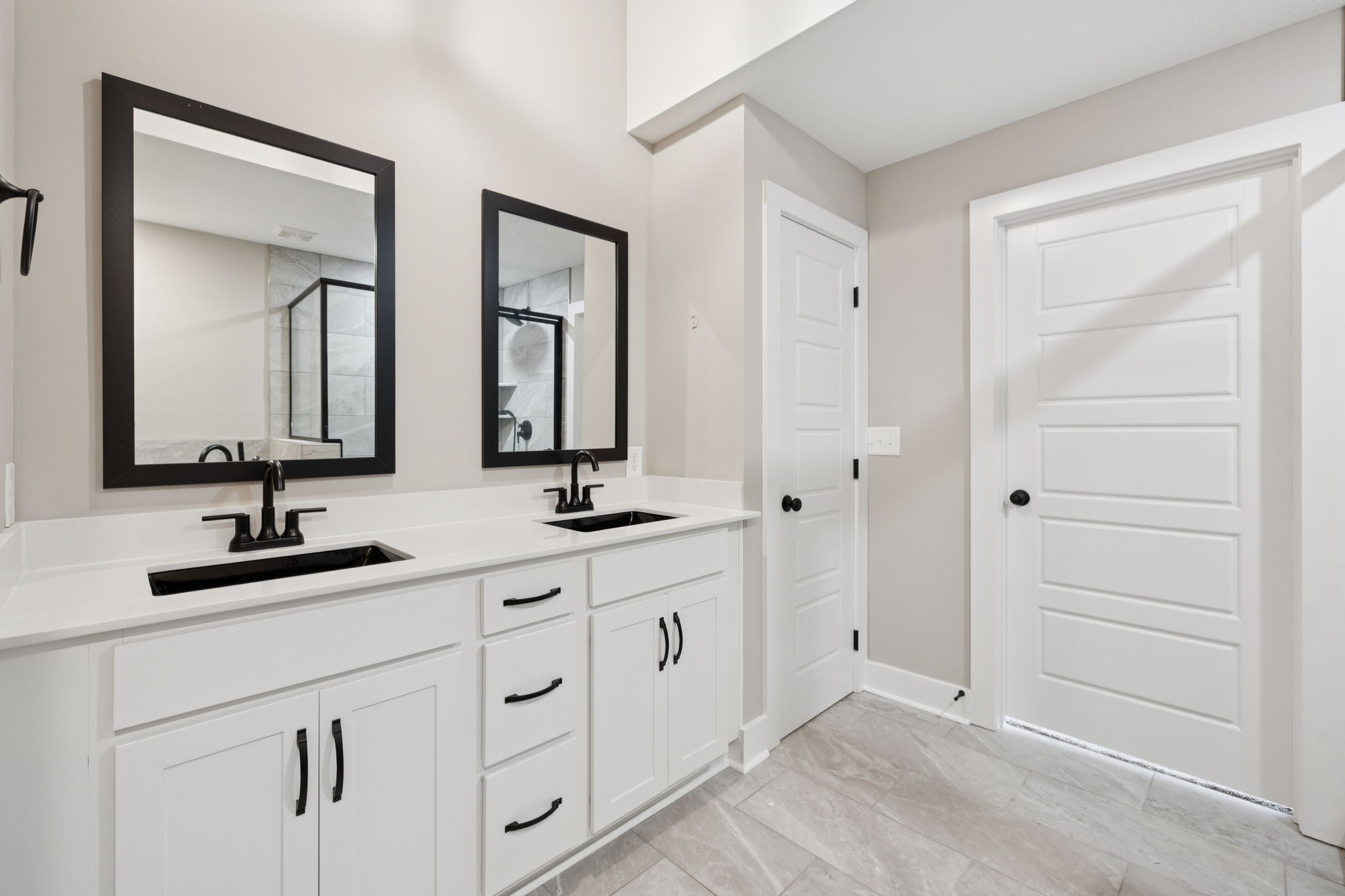 3935 Harmony Grove Road Hopkinsville, KY 42240 - Photo 30 of 64 a bathroom with double vanity sinks and a mirror
