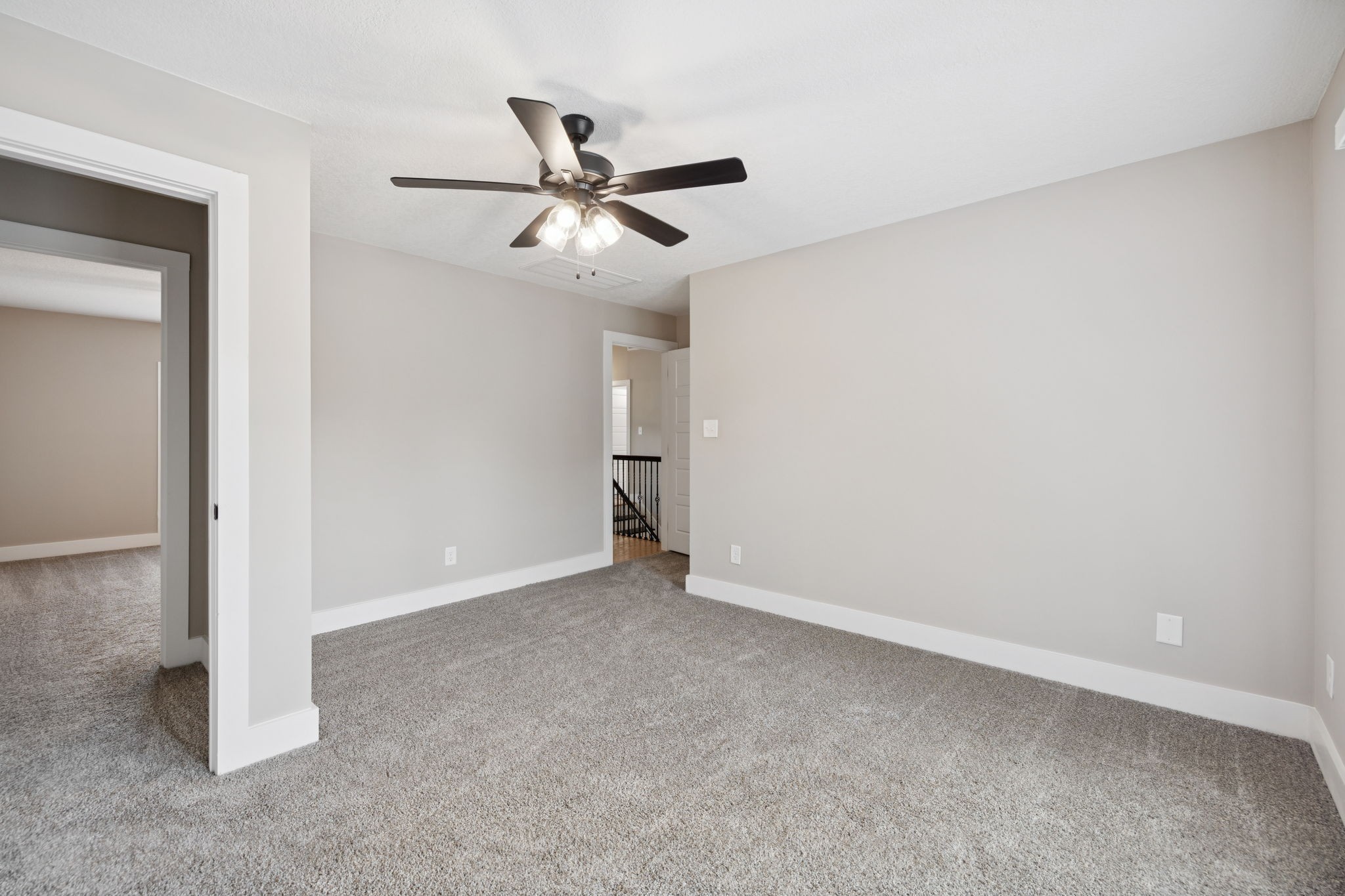 3935 Harmony Grove Road Hopkinsville, KY 42240 - Photo 36 of 64 an empty room with a ceiling fan and carpet