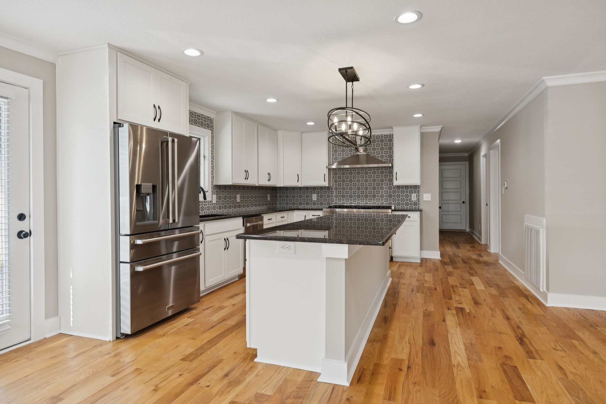 3935 Harmony Grove Road Hopkinsville, KY 42240 - Photo 8 of 64 a kitchen with kitchen island stainless steel appliances a sink stove and refrigerator