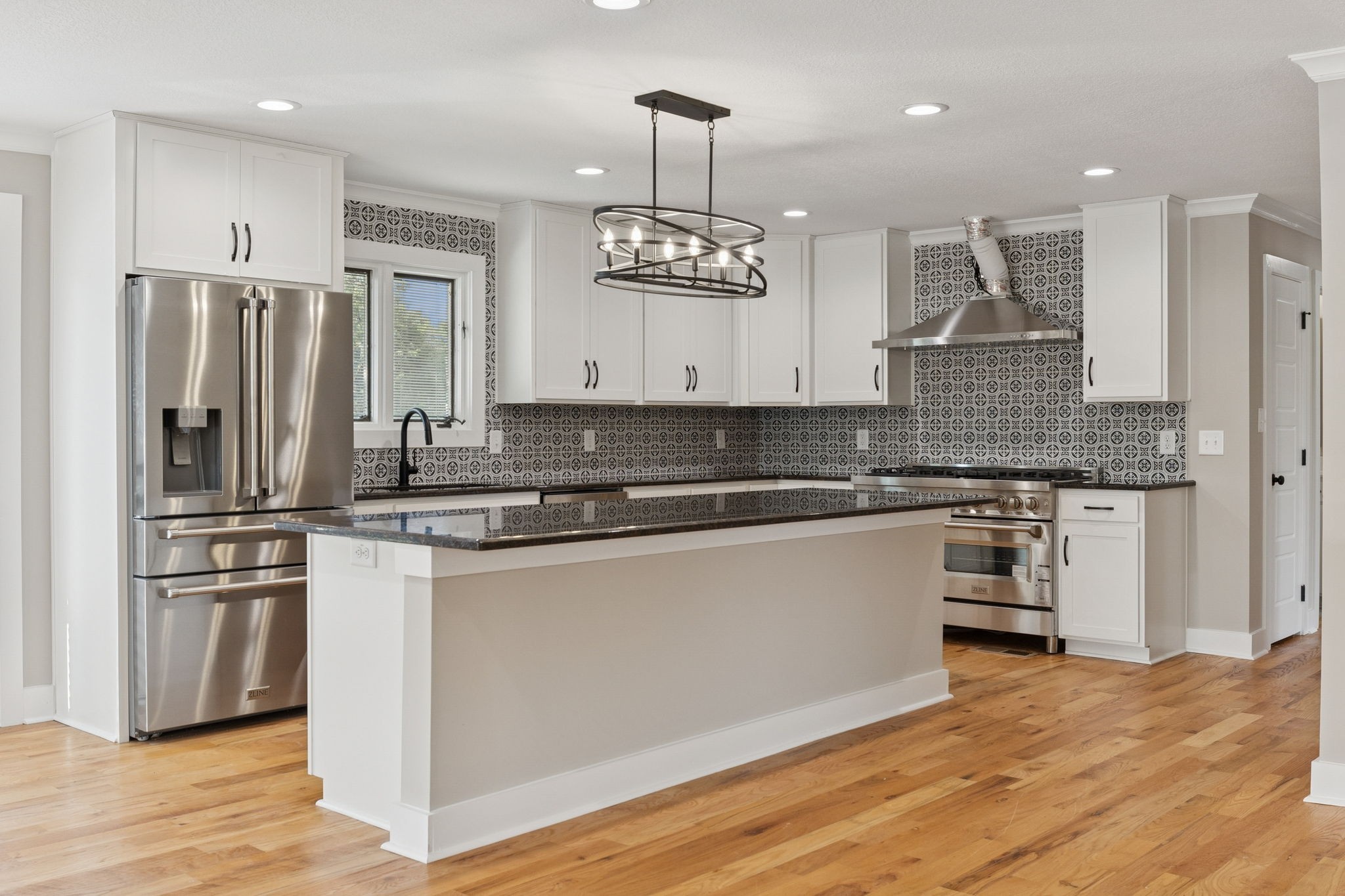 3935 Harmony Grove Road Hopkinsville, KY 42240 - Photo 9 of 64 a large kitchen with stainless steel appliances granite countertop a stove a refrigerator and a granite counter tops