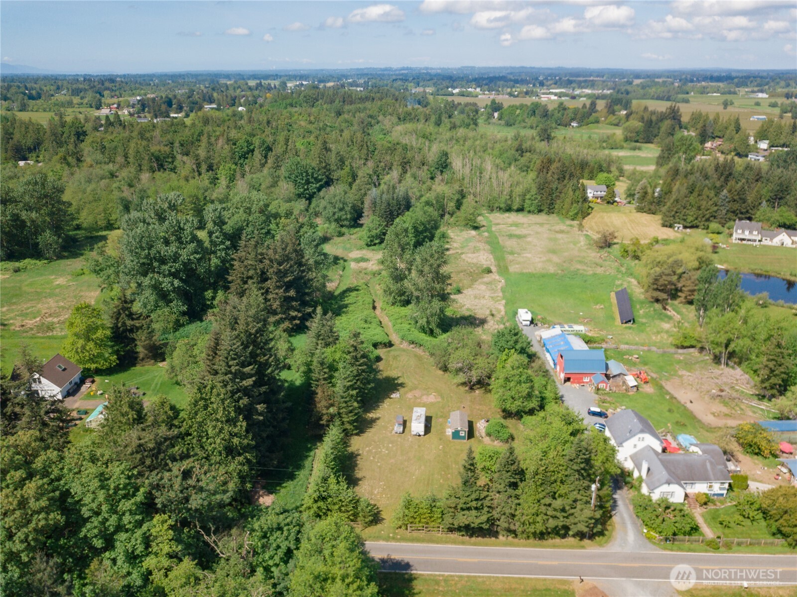 6011 Medcalf Road Bellingham, WA 98226 - Photo 1 of 22 an aerial view of residential house with outdoor space and trees all around