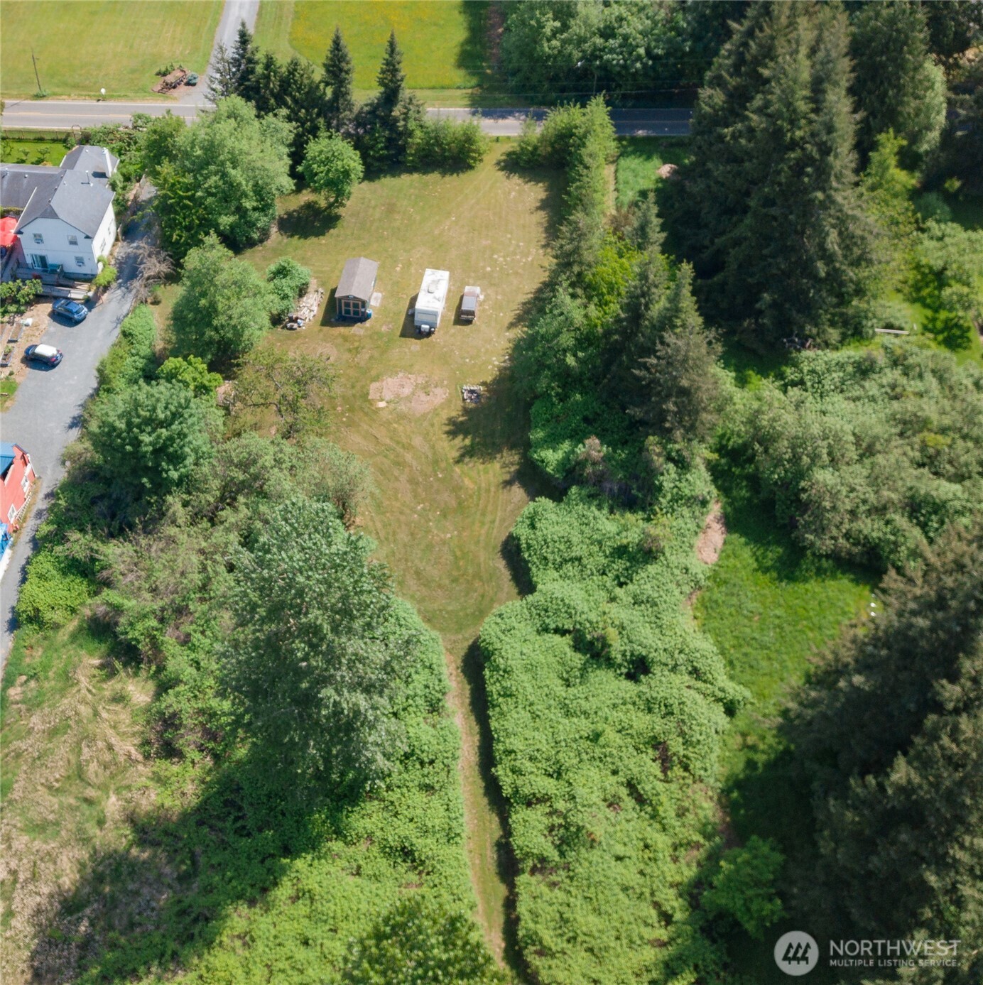 6011 Medcalf Road Bellingham, WA 98226 - Photo 4 of 22 an aerial view of a house with a yard and lake view