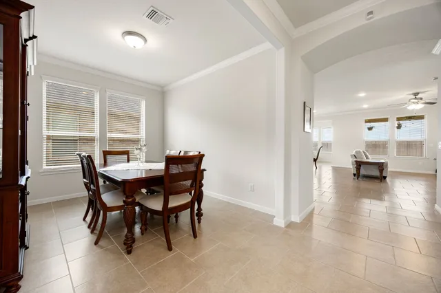 a view of a dining room with furniture and a table