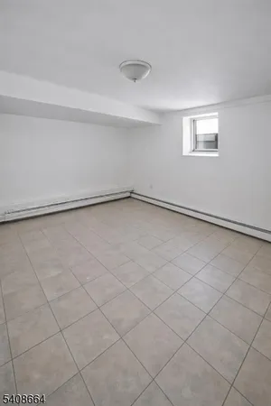 a view of an empty room and a window
