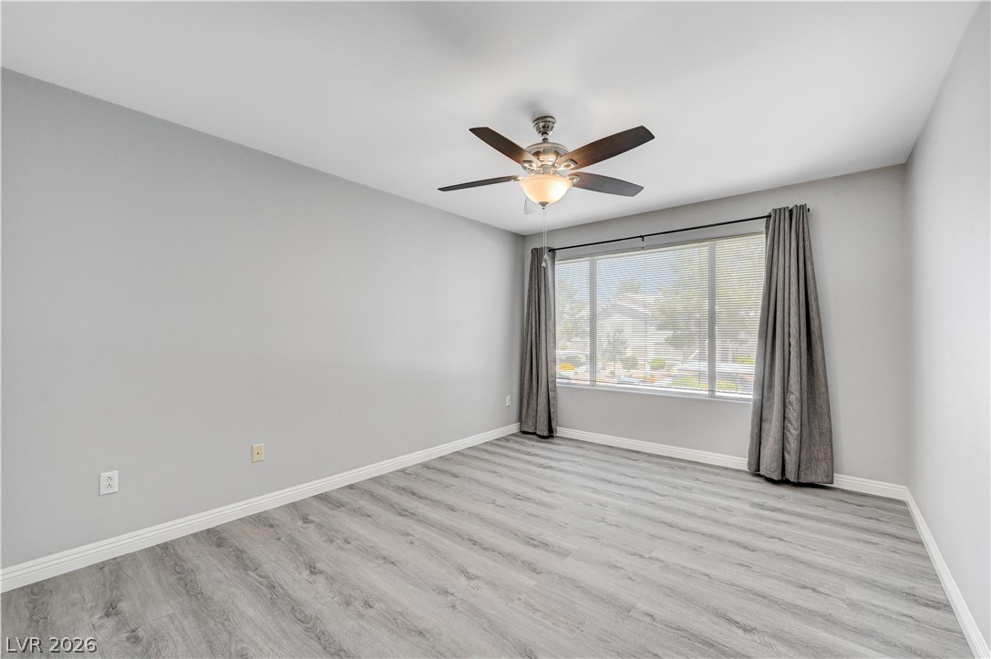 3425 East Russell Road, Unit 223 Las Vegas, NV 89120 - Photo 28 of 47 A well-proportioned interior with light-toned wood flooring and a refreshing ceiling fan.