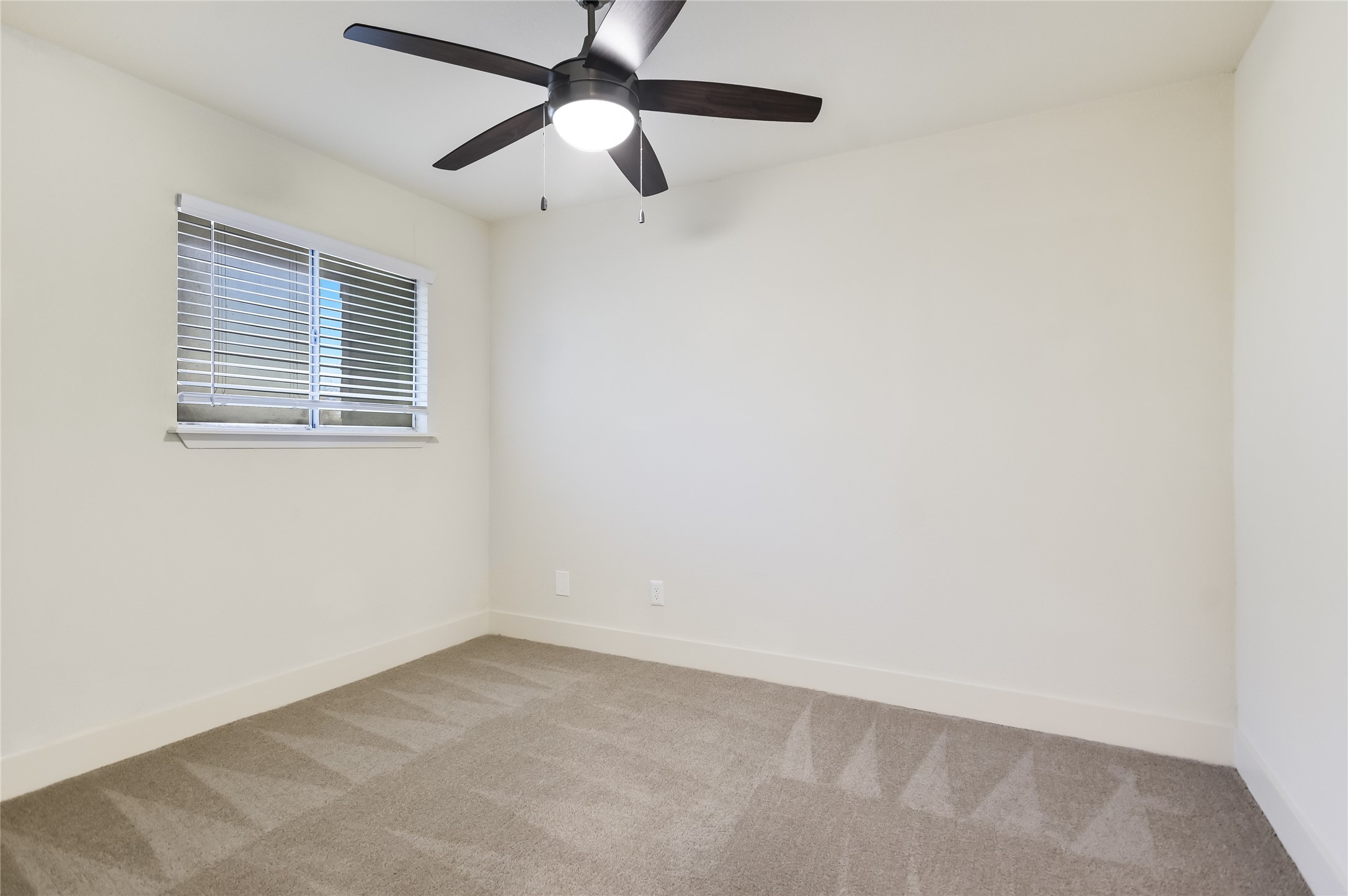1200 Fairmount Avenue Austin, TX 78704 - Photo 11 of 14 Empty room featuring carpet and ceiling fan