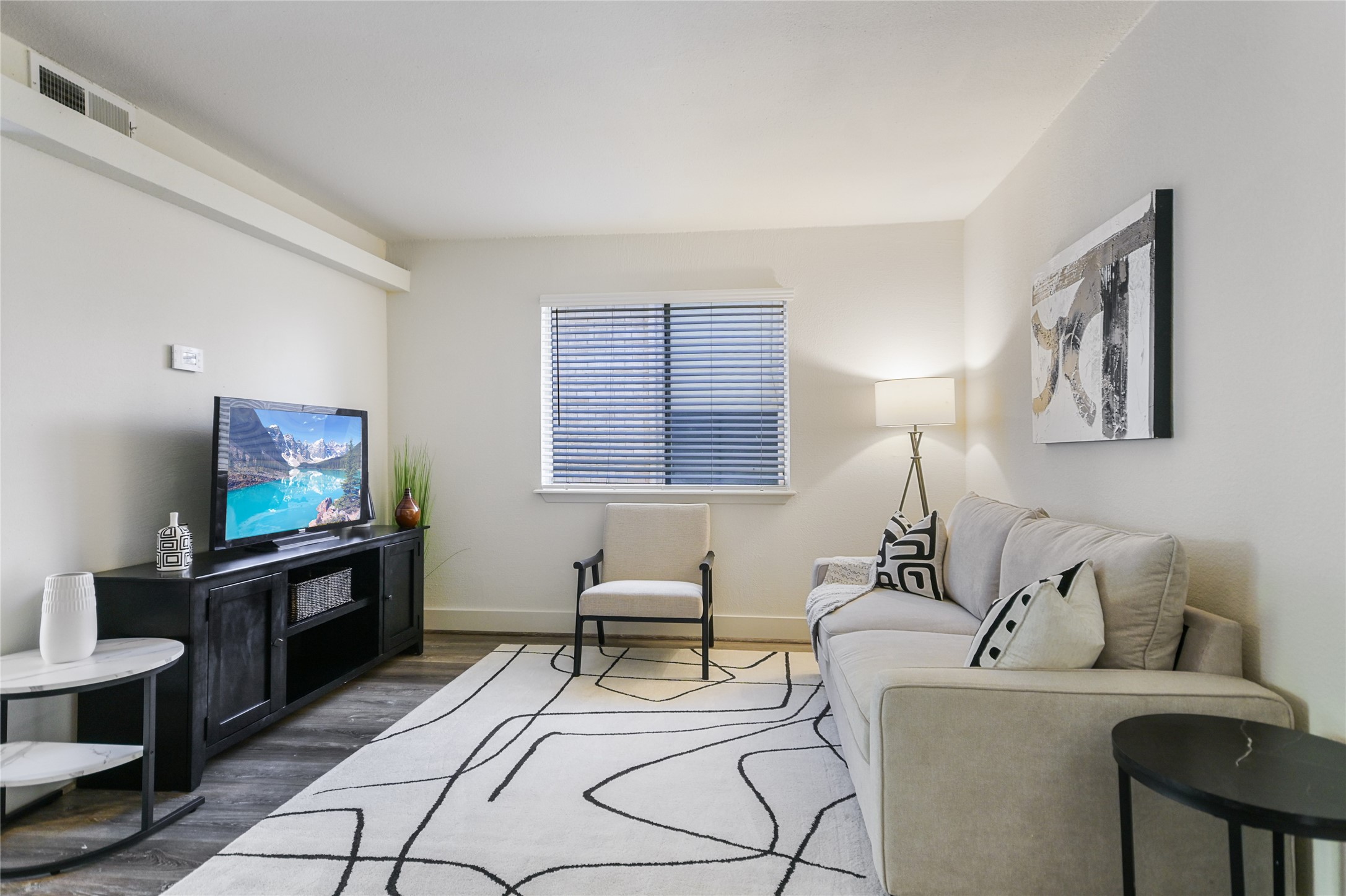 1200 Fairmount Avenue Austin, TX 78704 - Photo 3 of 14 Living room featuring wood finished floors and baseboards