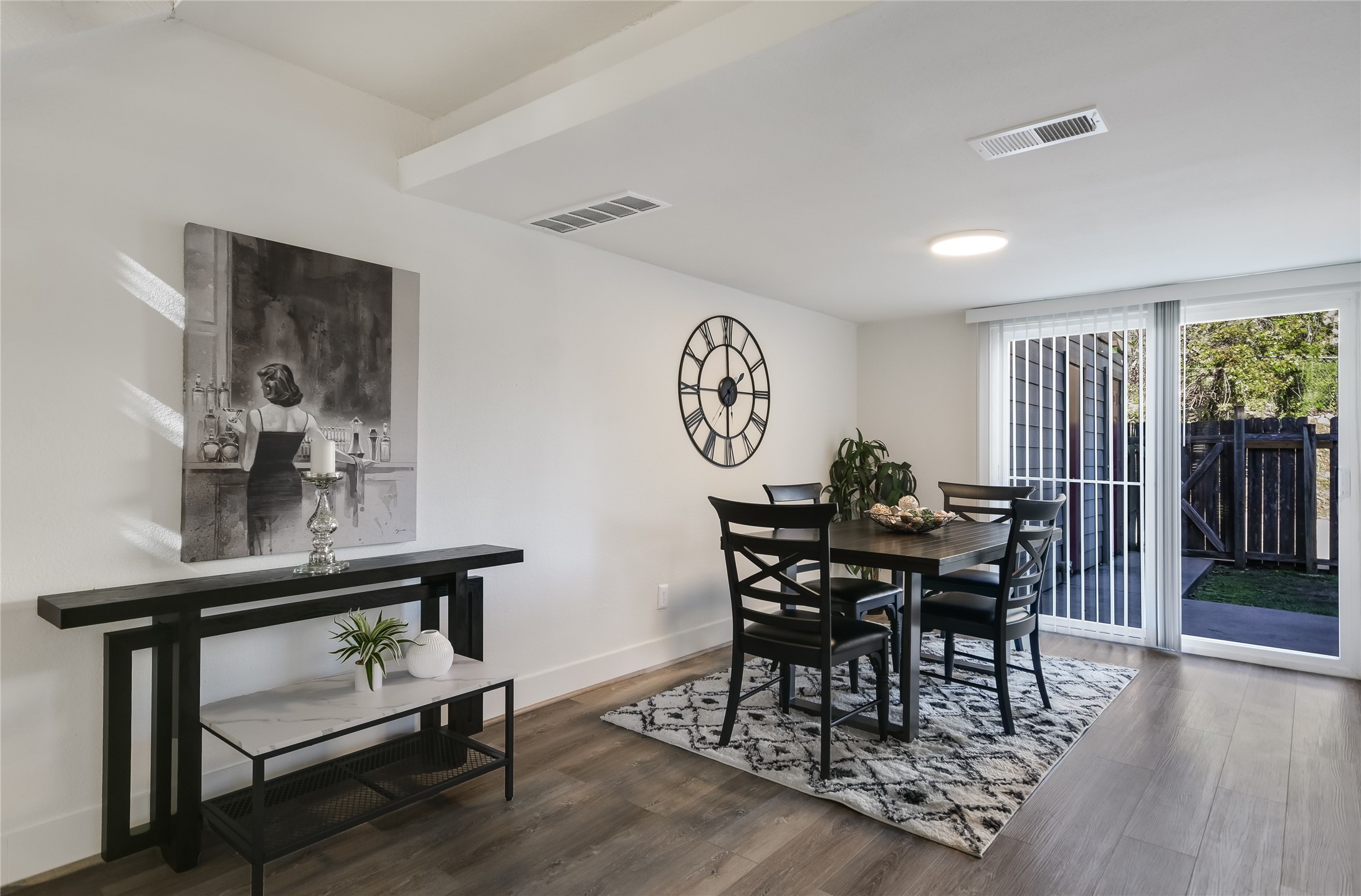 1200 Fairmount Avenue Austin, TX 78704 - Photo 5 of 14 Dining area featuring wood finished floors and expansive windows