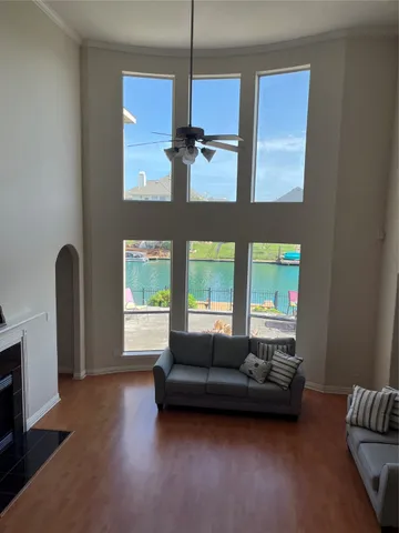 a living room with furniture and a large window