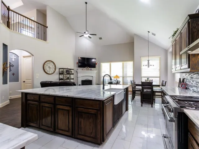 a kitchen with cabinets and stainless steel appliances