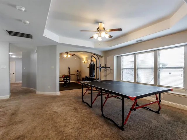 a view of a livingroom with furniture and a table
