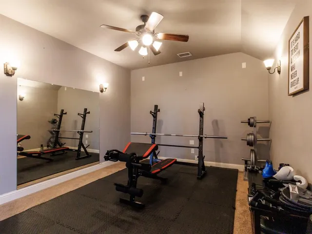 a view of a room with gym equipment