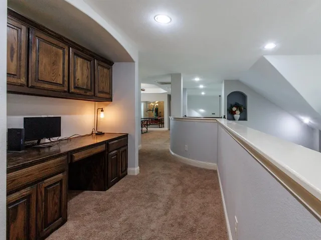 a large kitchen with stainless steel appliances granite countertop a stove and a sink