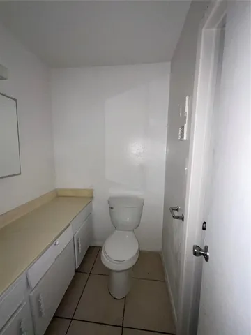 a bathroom with a toilet and a sink
