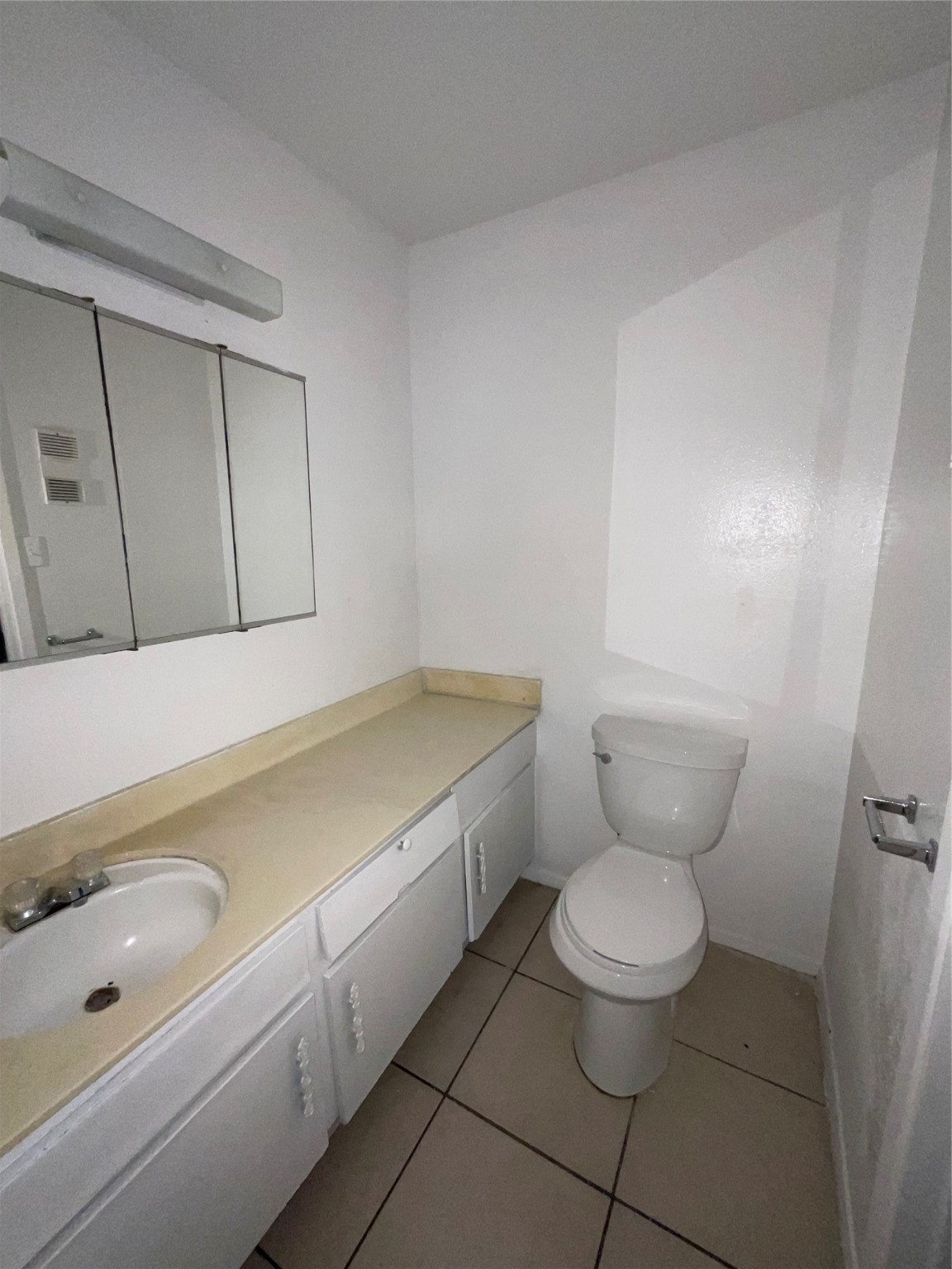6161 Reims Road, Unit 1305 Houston, TX 77036 - Photo 16 of 28 a bathroom with a toilet sink and mirror