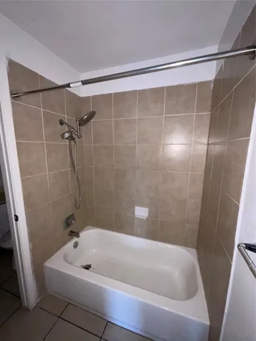 a bathroom with a bath tub