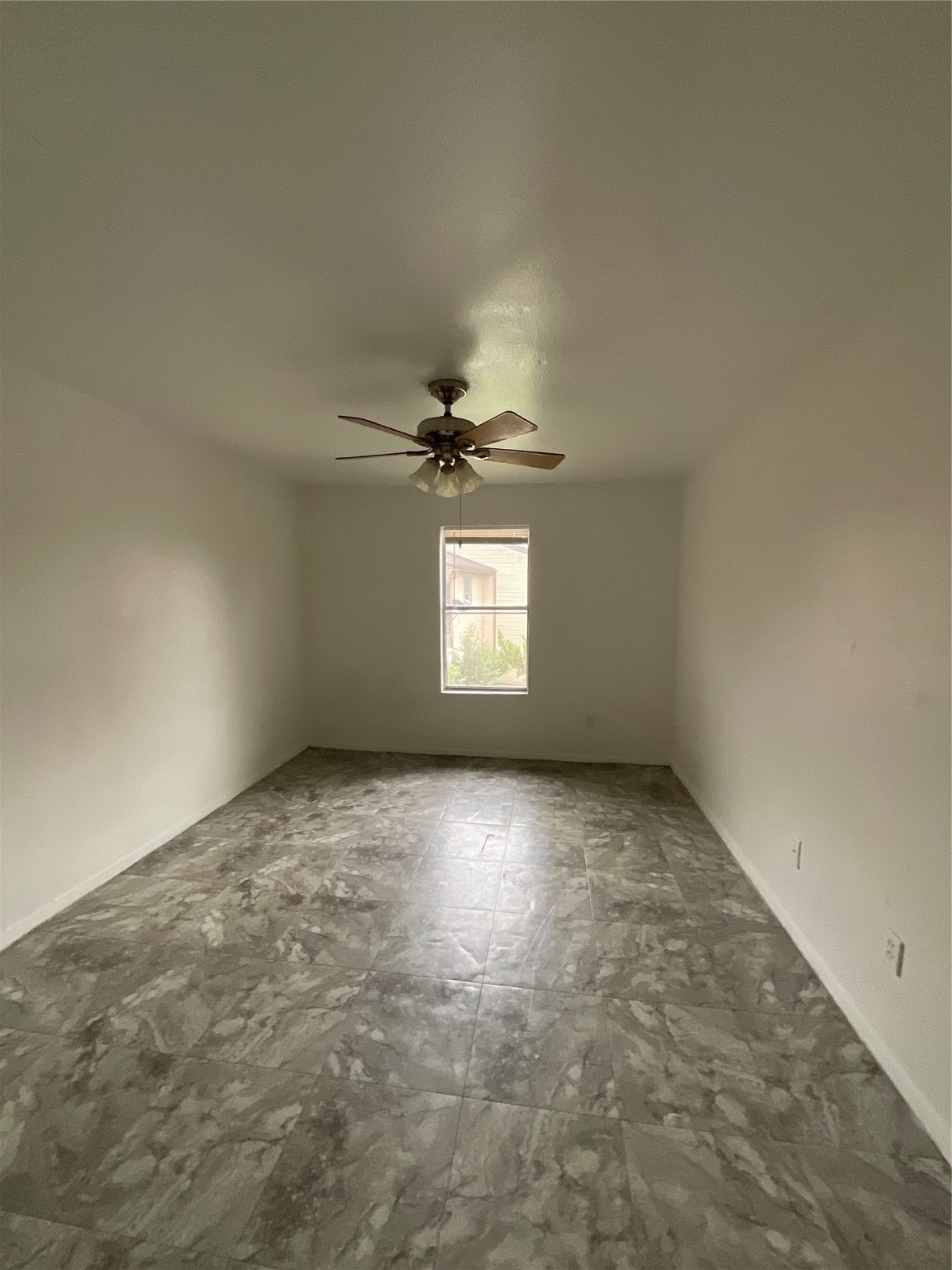 6161 Reims Road, Unit 1305 Houston, TX 77036 - Photo 19 of 28 a view of an empty room and window
