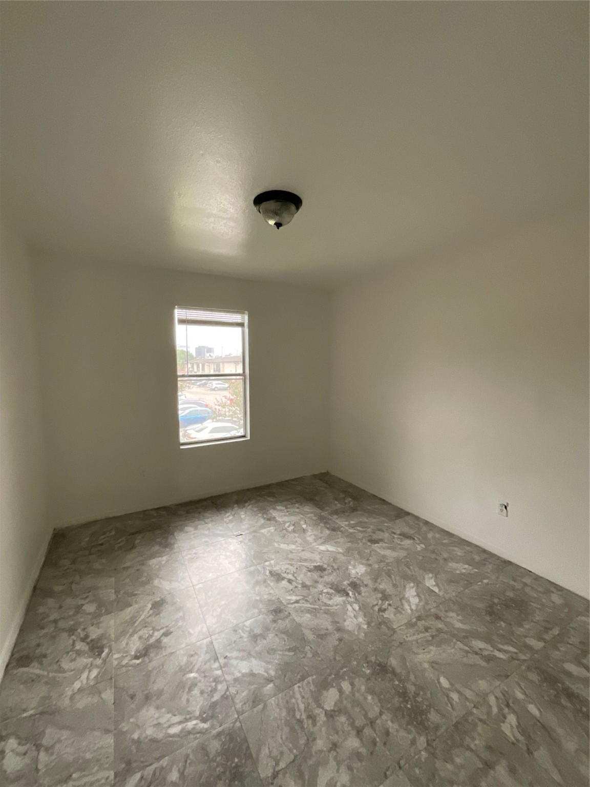 6161 Reims Road, Unit 1305 Houston, TX 77036 - Photo 22 of 28 an empty room with a window