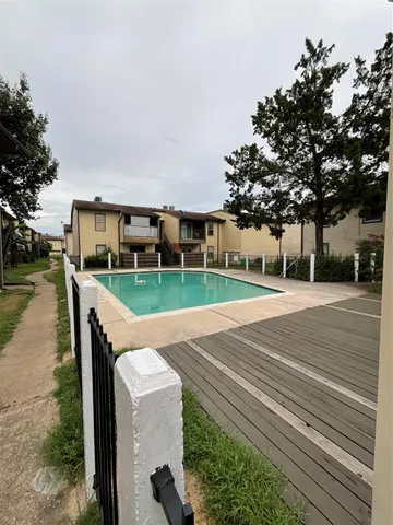 a view of house with outdoor space and sitting area