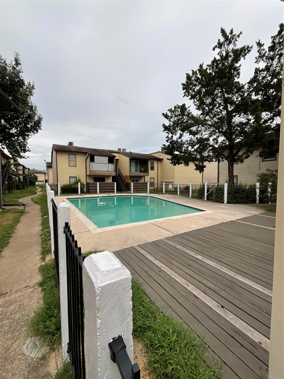 6161 Reims Road, Unit 1305 Houston, TX 77036 - Photo 25 of 28 a view of house with outdoor space and sitting area