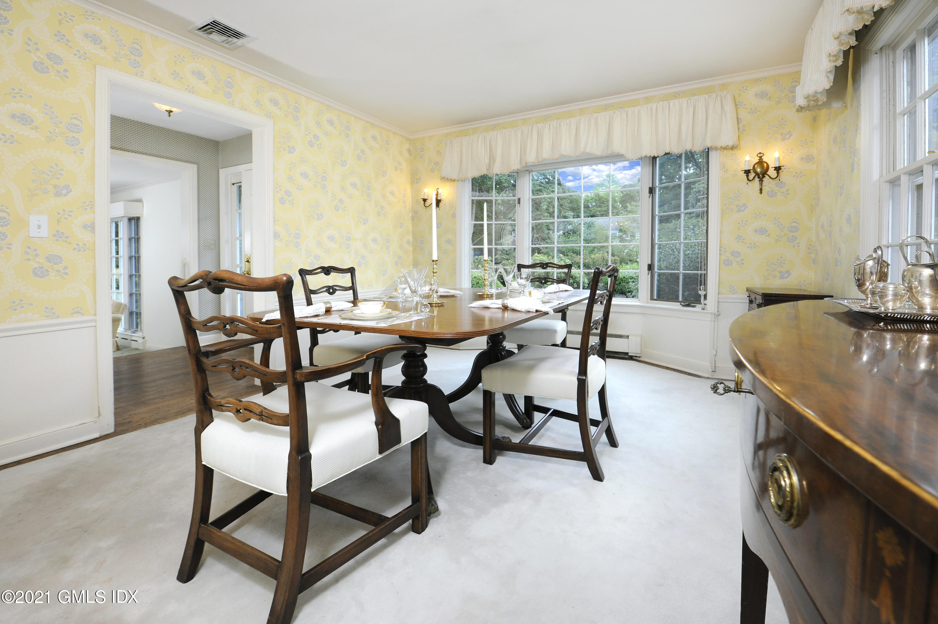 64 Hillside Road Greenwich, CT 06830 - Photo 11 of 24 a dining room with furniture and a floor to ceiling window