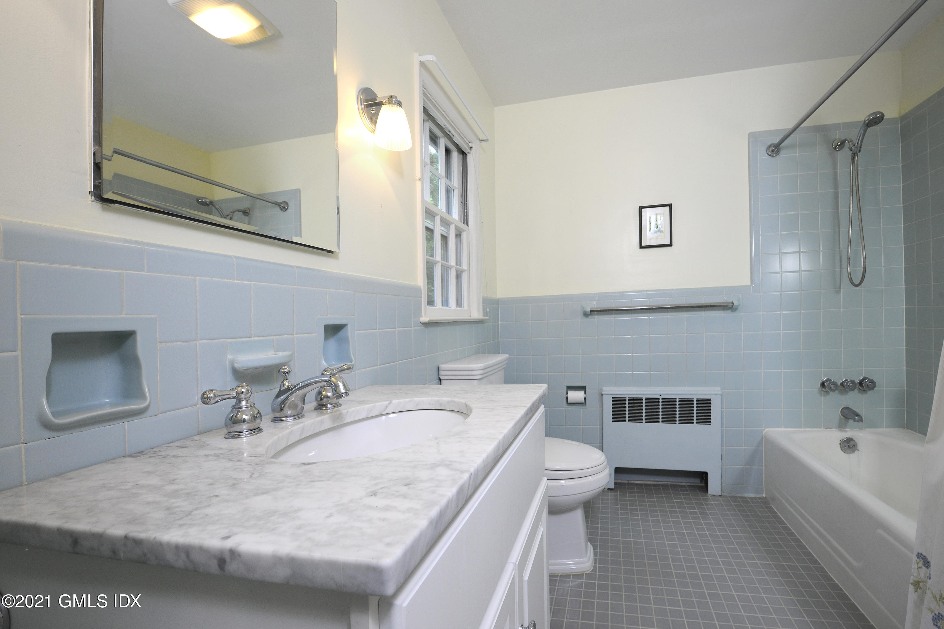 64 Hillside Road Greenwich, CT 06830 - Photo 15 of 24 a bathroom with a granite countertop sink a toilet and bathtub