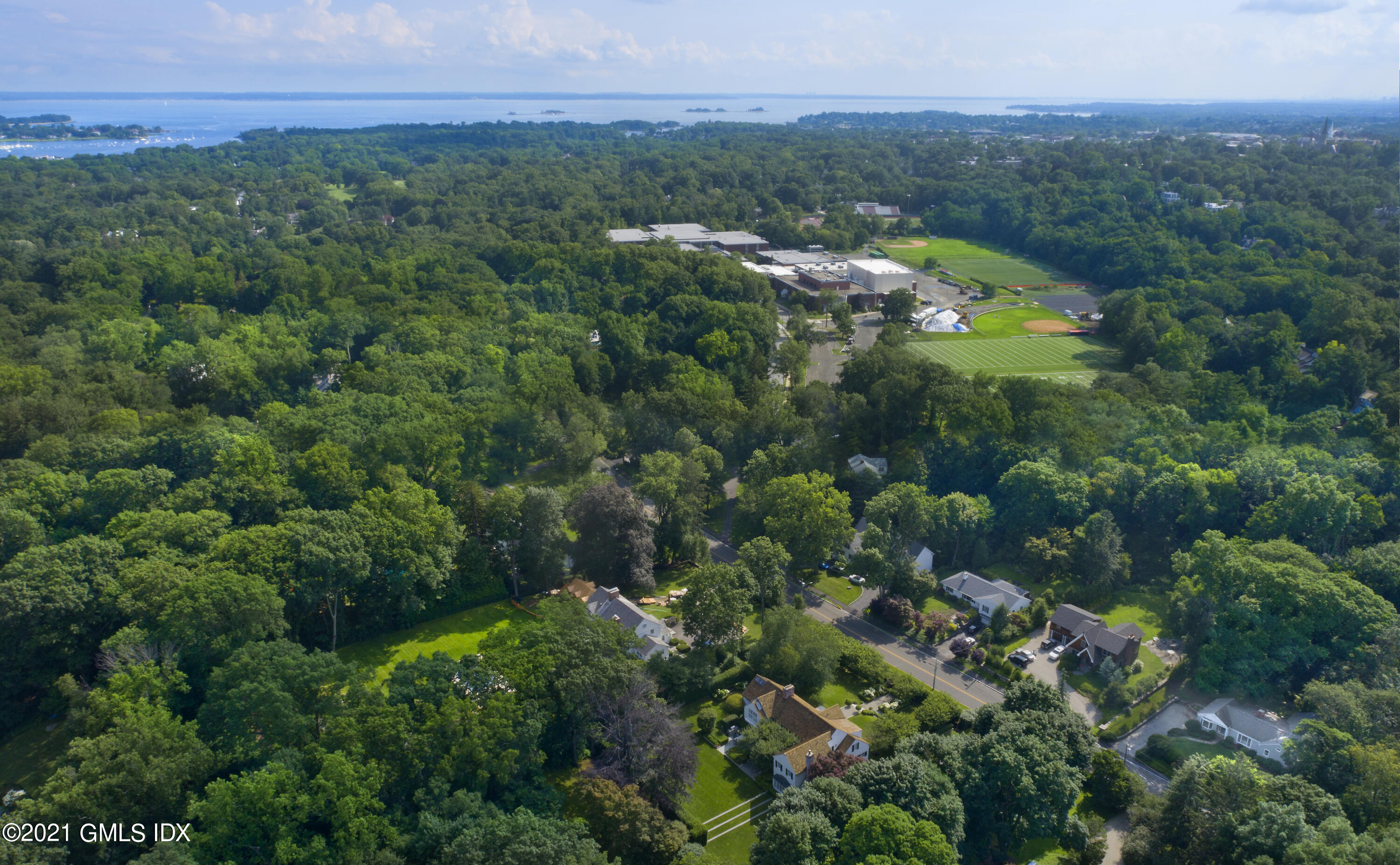 64 Hillside Road Greenwich, CT 06830 - Photo 4 of 24 a view of a city with lush green forest