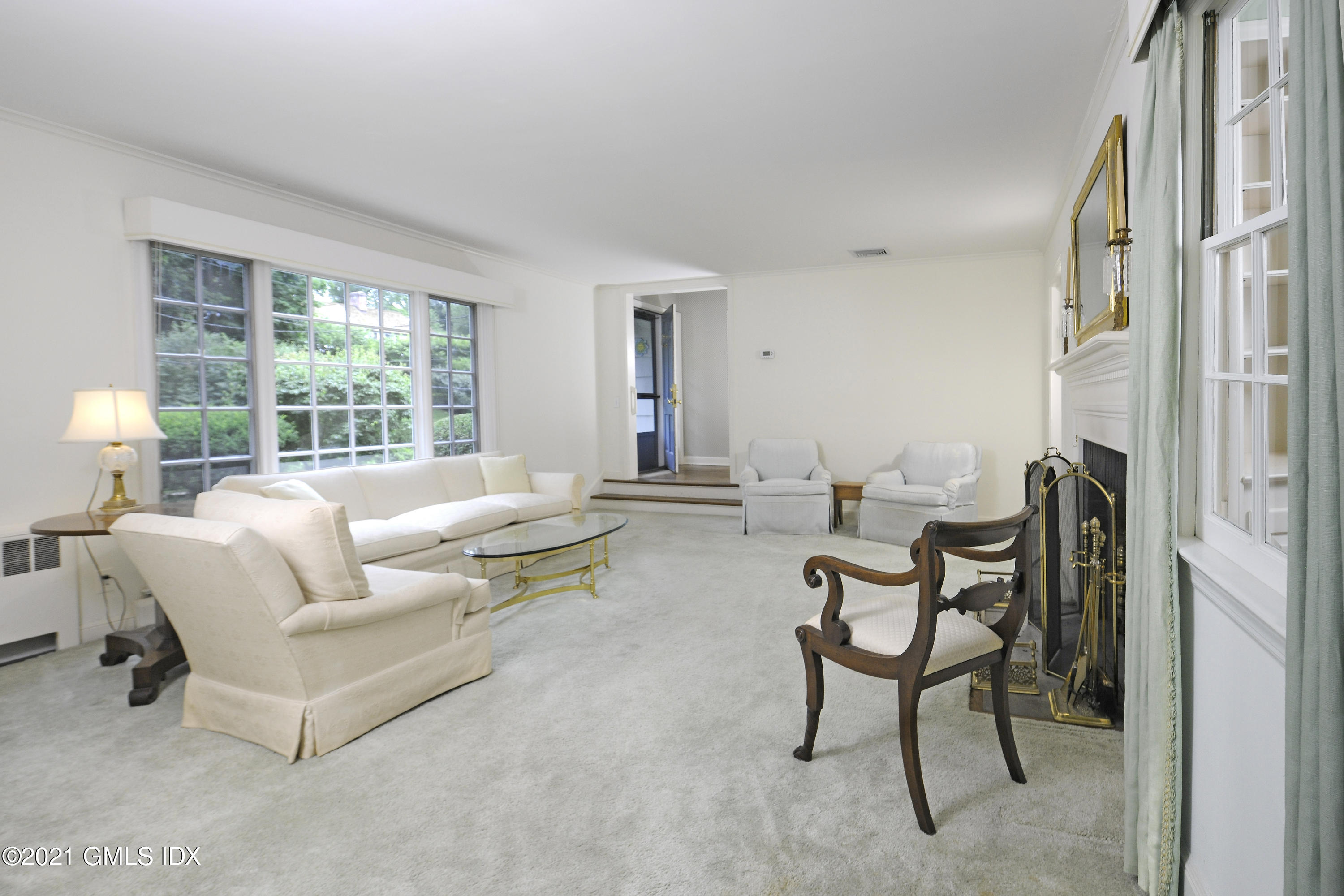 64 Hillside Road Greenwich, CT 06830 - Photo 6 of 24 a living room with furniture and a large window