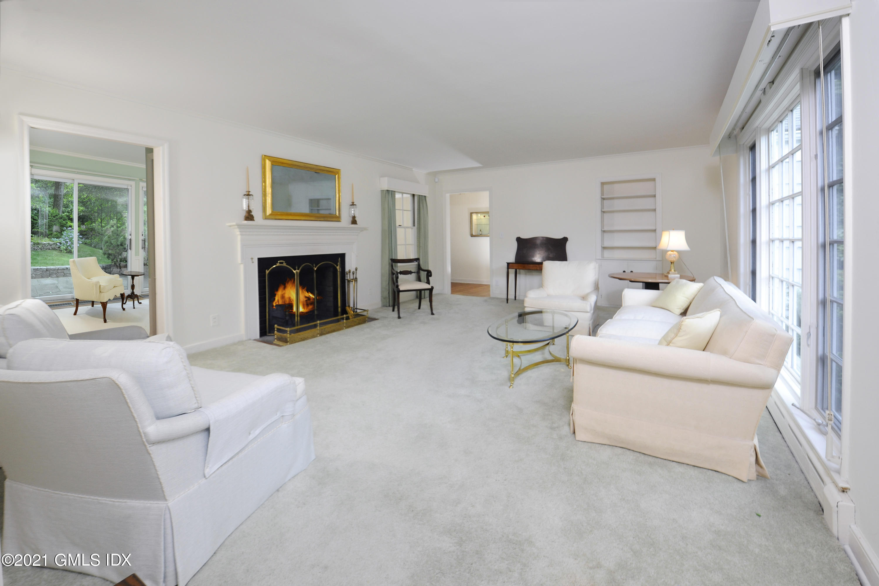 64 Hillside Road Greenwich, CT 06830 - Photo 7 of 24 a living room with furniture and a fireplace