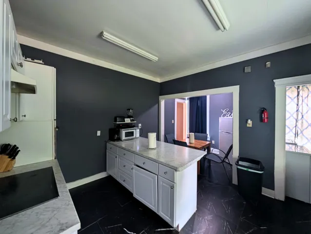 a kitchen with a sink stove and refrigerator