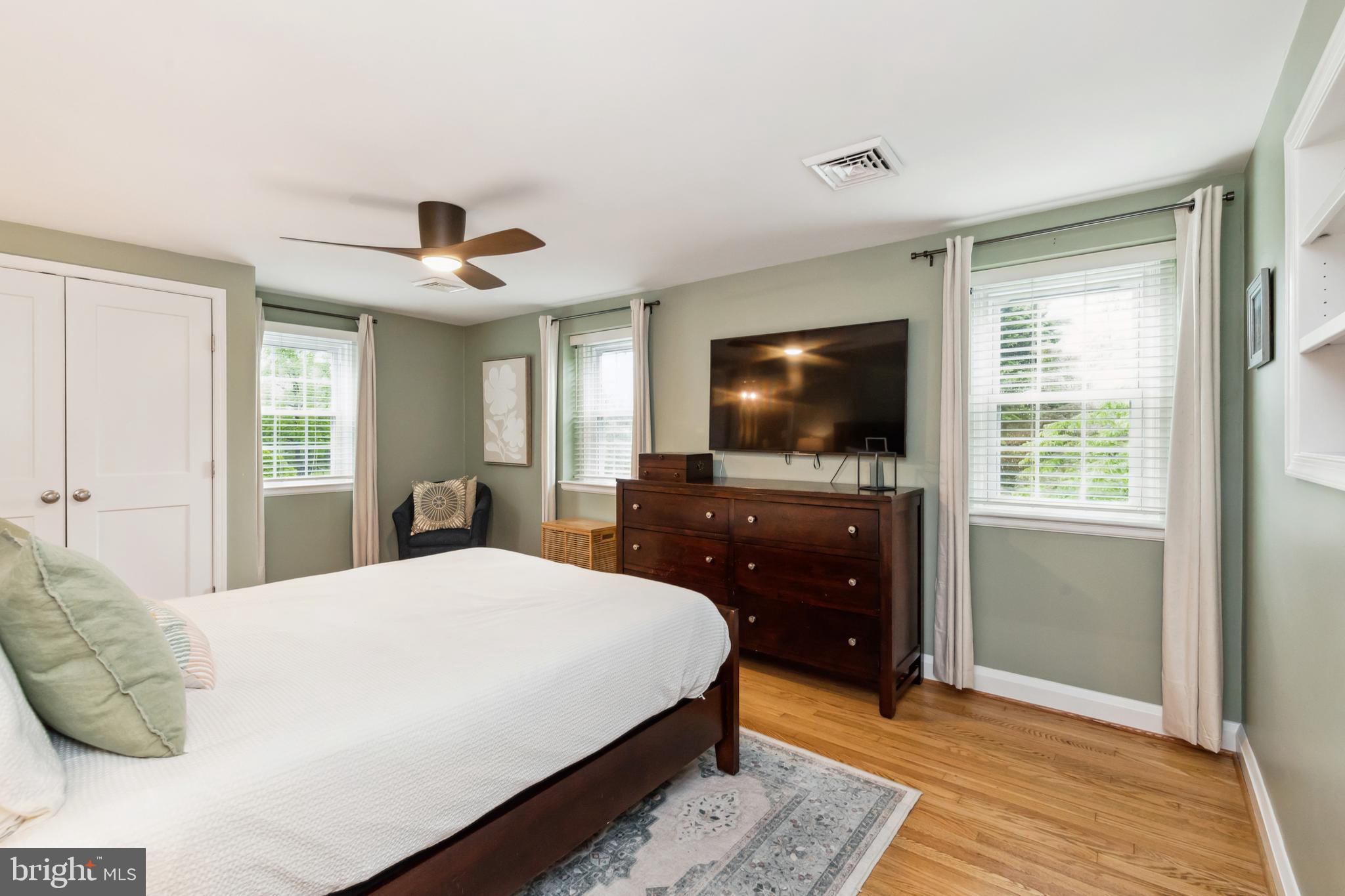 511 Wilton Road Towson, MD 21286 - Photo 18 of 39 a bedroom with a bed and a flat screen tv
