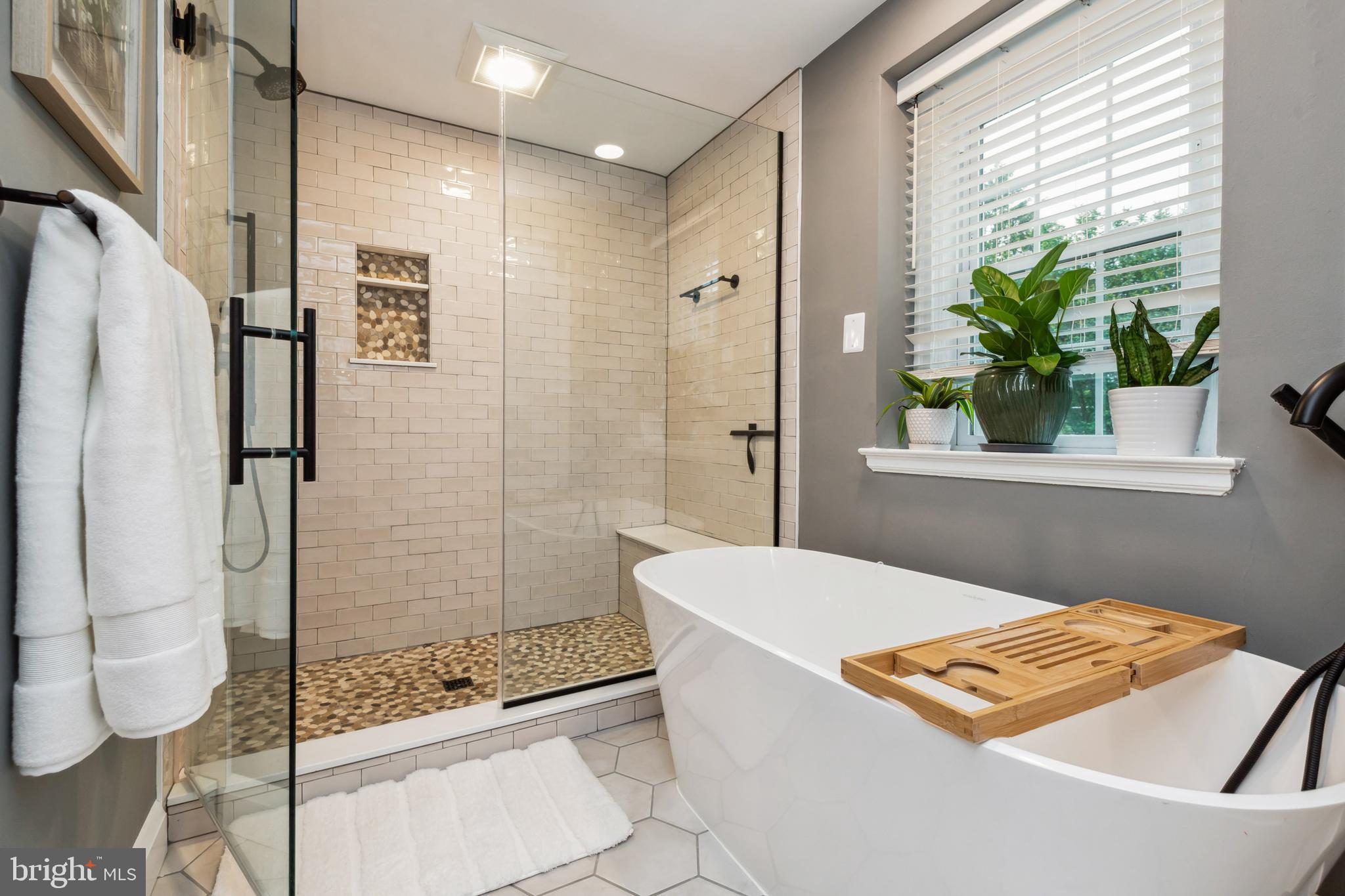 511 Wilton Road Towson, MD 21286 - Photo 21 of 39 a bathroom with a bathtub and shower