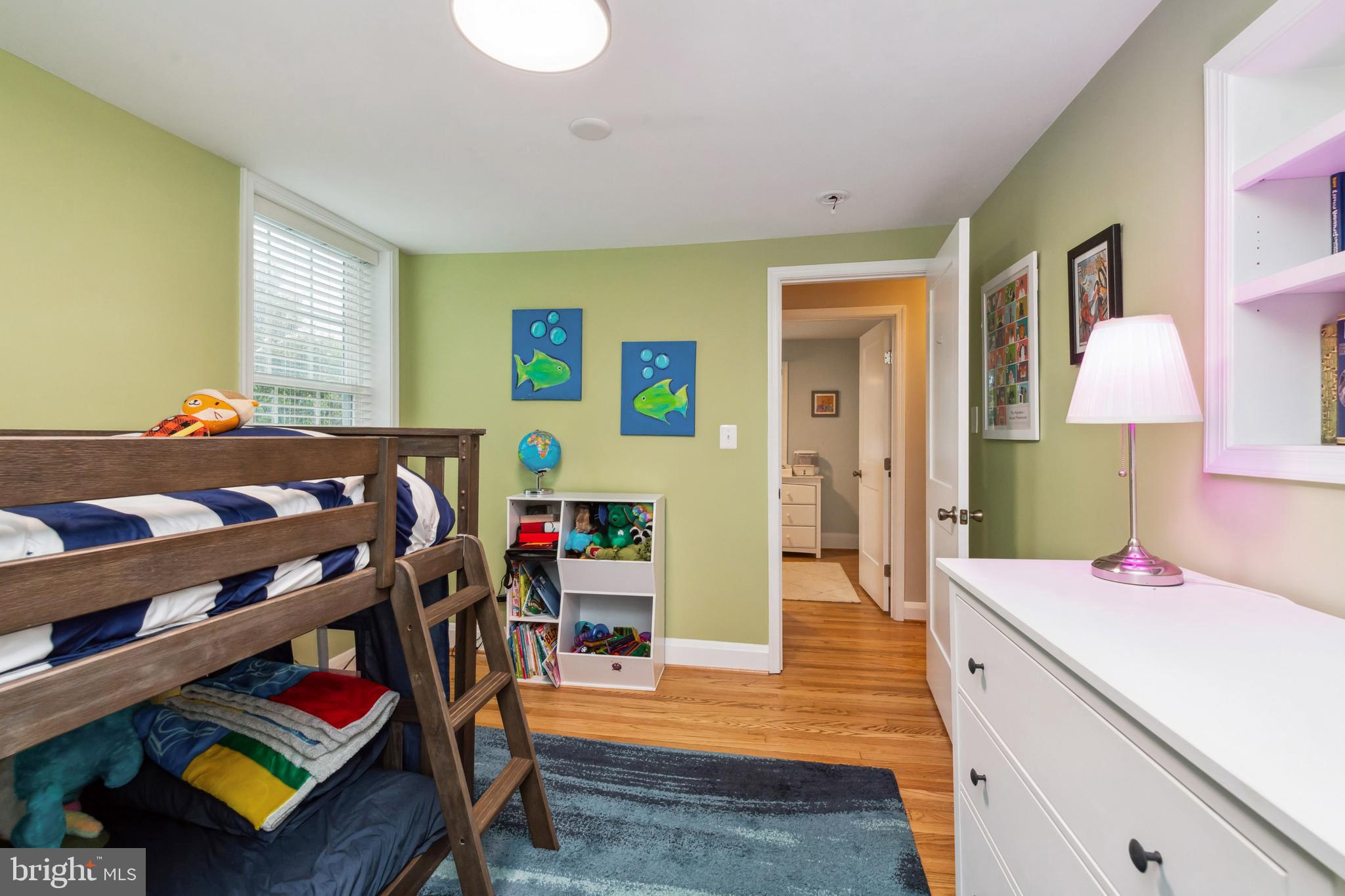 511 Wilton Road Towson, MD 21286 - Photo 23 of 39 a bed room with a bed and a book shelf