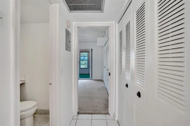 a bathroom with a toilet and a sink